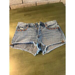 Driftwood Vintage-Style Denim Shorts With Embroidered Bird Patch & Fringe Detail